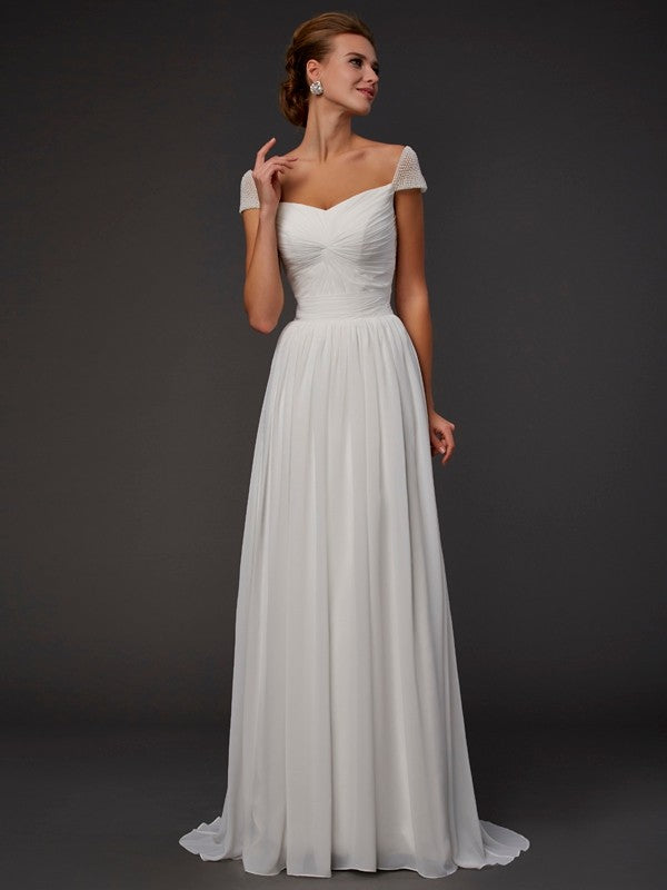 Vestidos largos de gasa con escote corazón, corte princesa, mangas cortas y abalorios